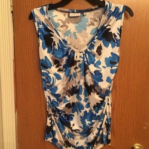 Very cute v neck, top w/smooth, satin feel.